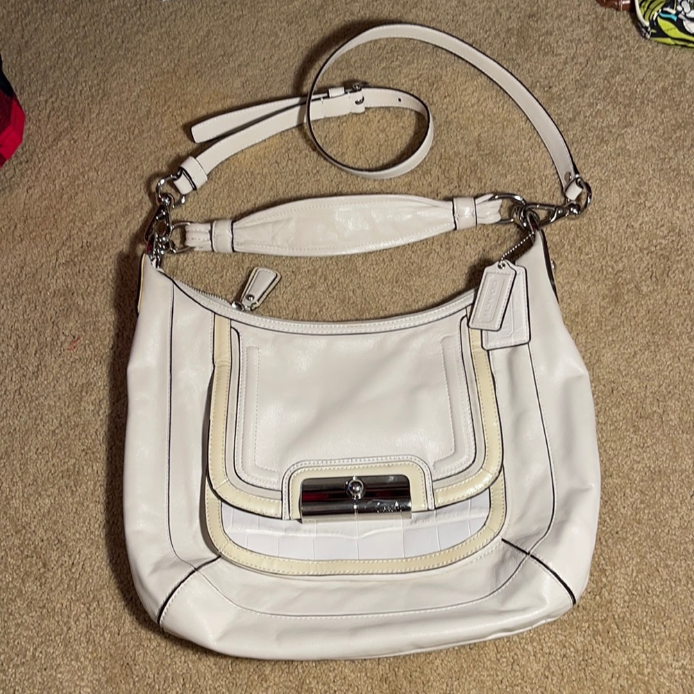 Coach purse, long shoulder strap and removable longer cross body strap.